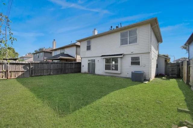 a view of a backyard with plants and a backyard