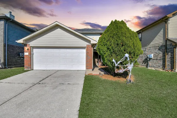 a view of backyard with a garden and entertaining space