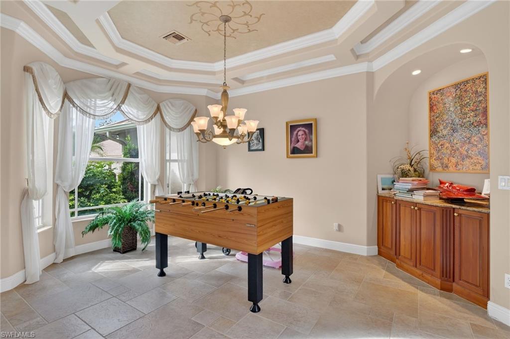 1964 Rialto Way Alva, FL 33920 - Photo 8 of 50 a living room with furniture and a chandelier