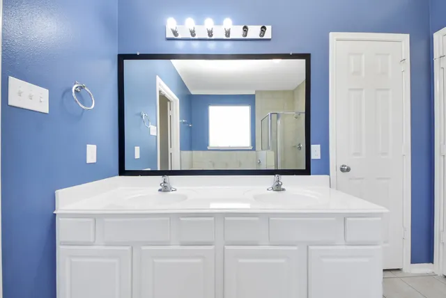 a bathroom with a bathtub and a sink