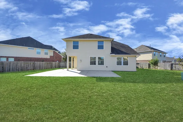 an aerial view of houses with outdoor space