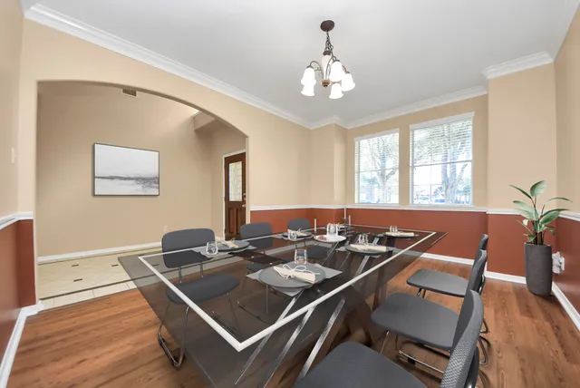 a view of a hallway view with wooden floor and staircase