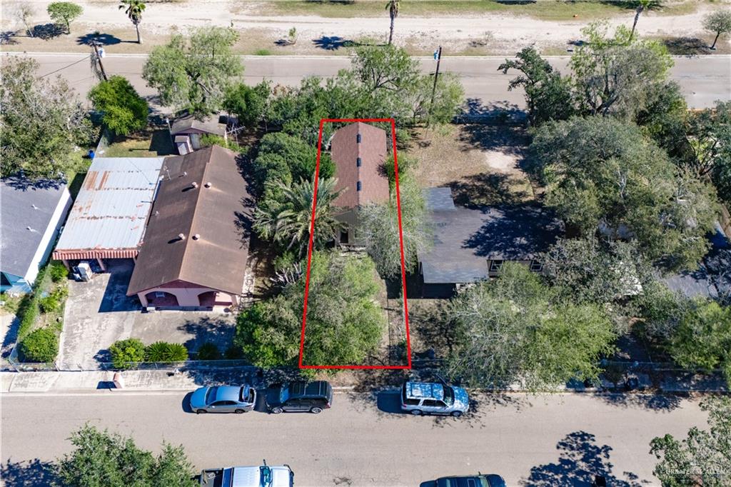 115 Guerra Avenue Weslaco, TX 78596 - Photo 13 of 17 an aerial view of a house with a garden and parking space