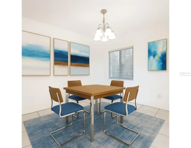 a view of a livingroom with an empty space and a chandelier fan