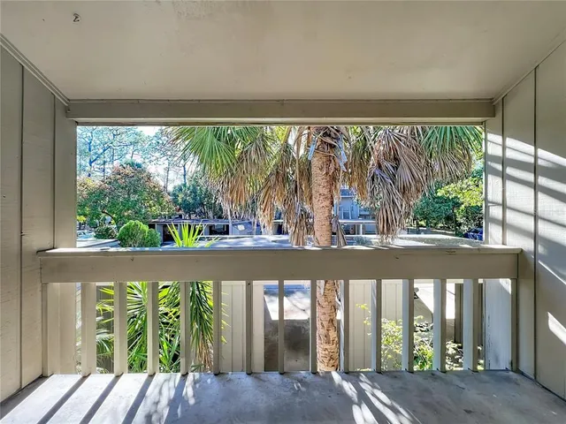 a view of balcony with yard