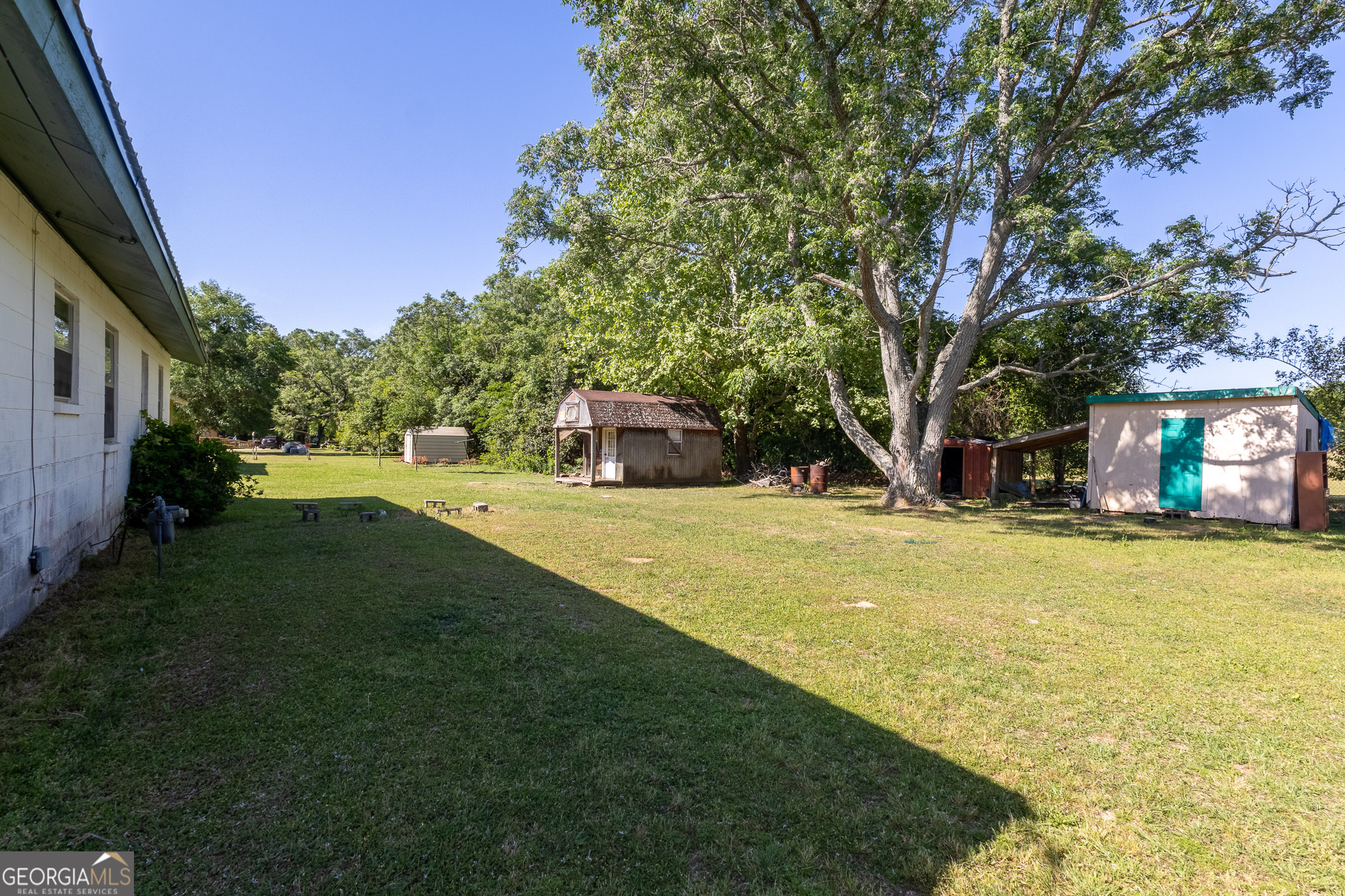 347 Peavy Street Unadilla, GA 31091 - Photo 14 of 15 a view of a house with swimming pool