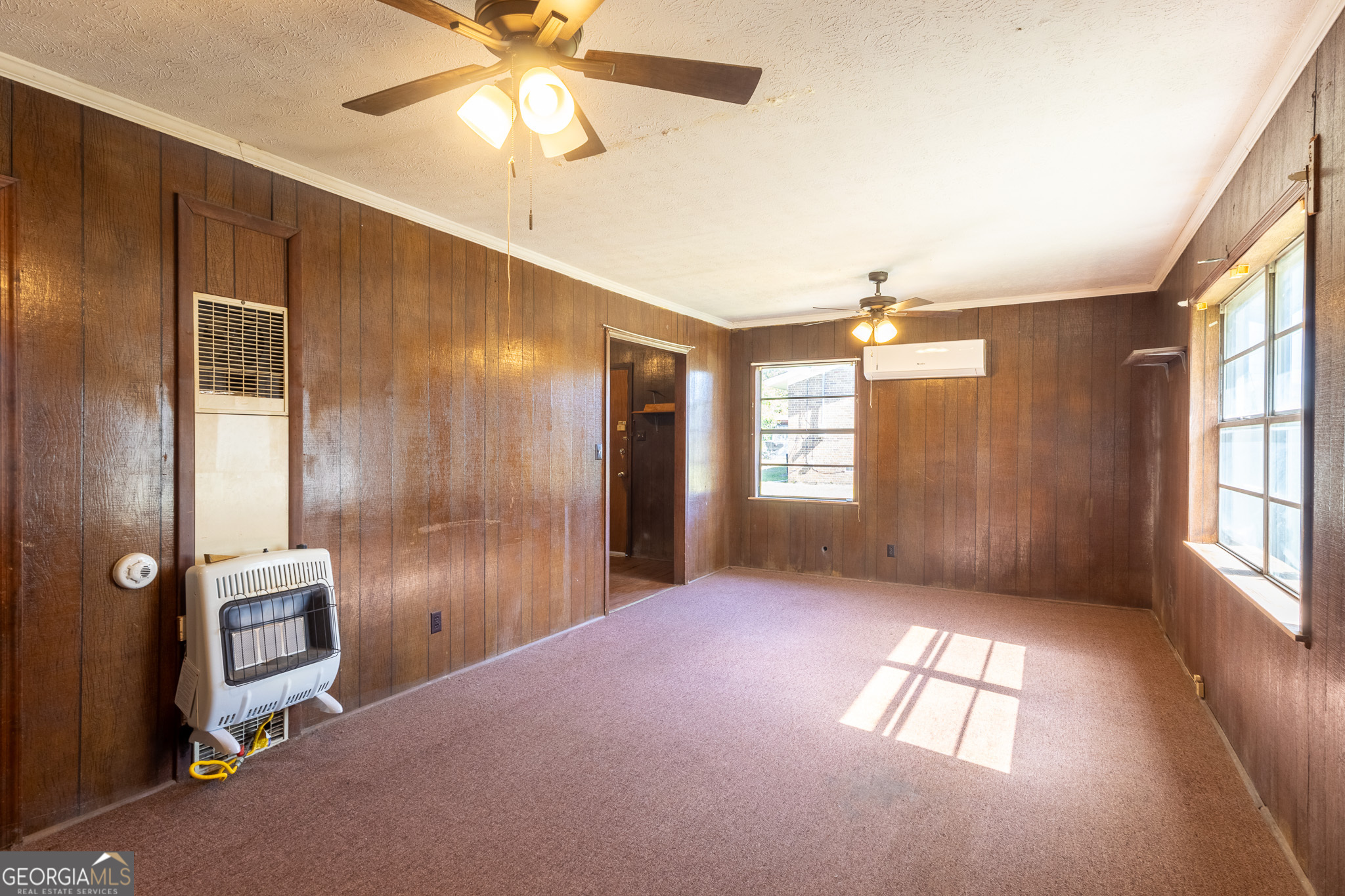 347 Peavy Street Unadilla, GA 31091 - Photo 4 of 15 a view of livingroom with window and ceiling fan