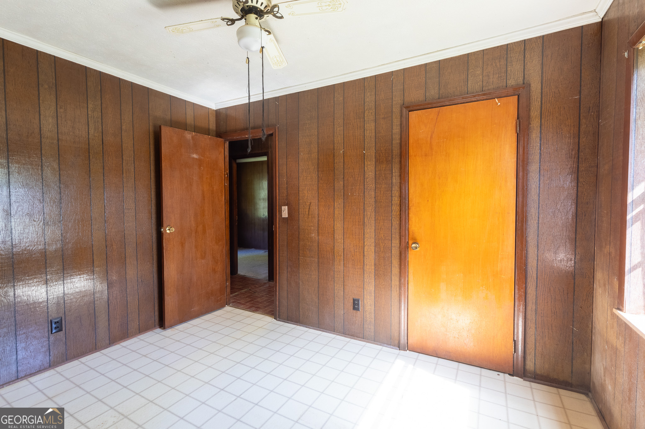 347 Peavy Street Unadilla, GA 31091 - Photo 10 of 15 a bedroom with a bed and a chandelier