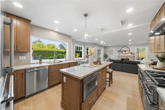 a kitchen with stainless steel appliances granite countertop a stove and a sink