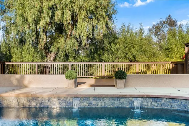 a view of a house with a backyard and a patio