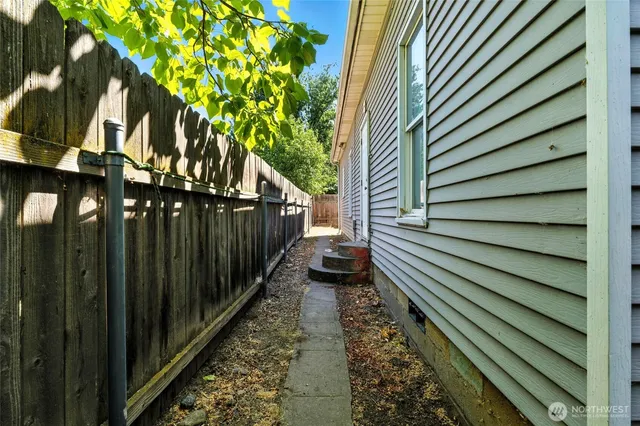 a pathway of a house with a yard