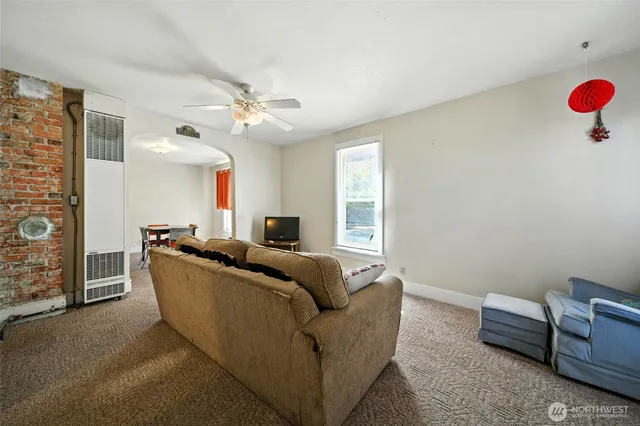 a living room with furniture and a window