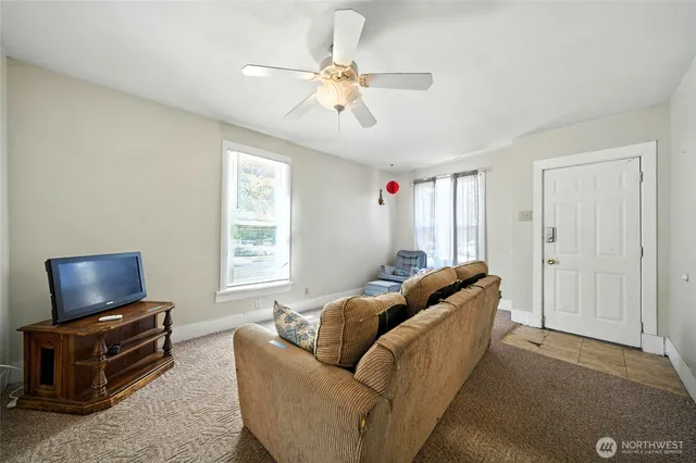 a living room with furniture and a window