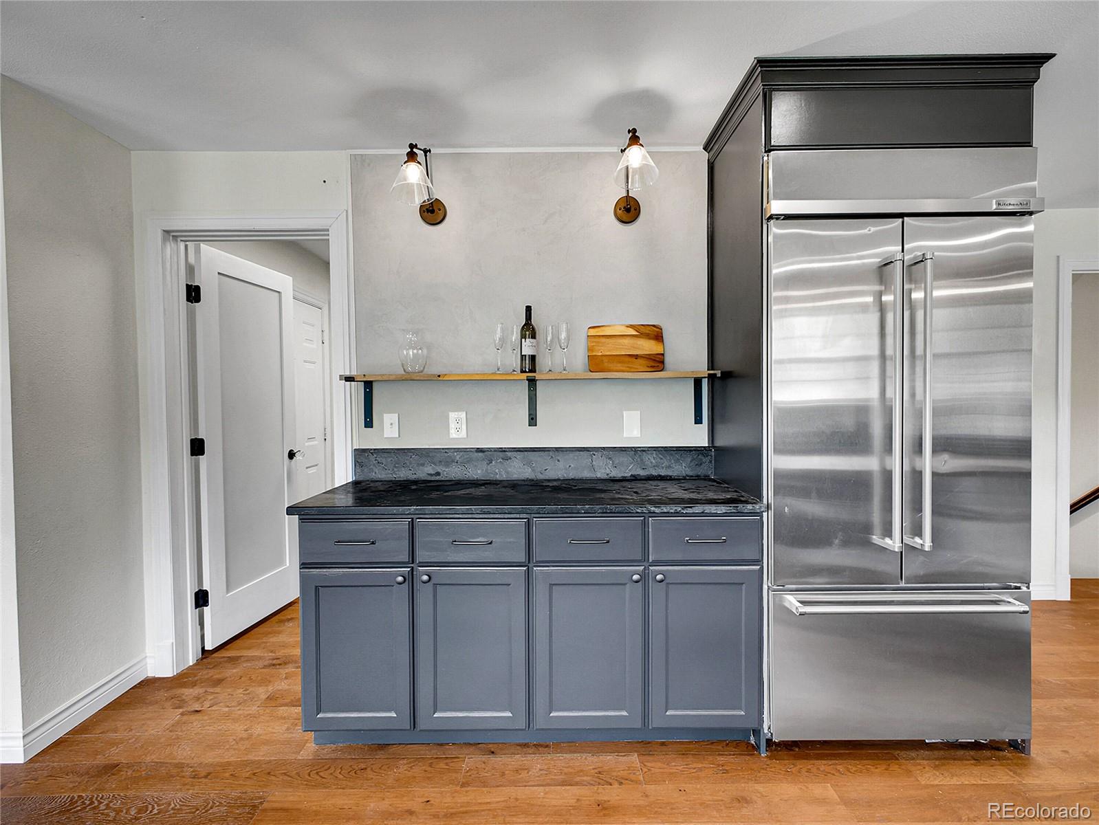 2635 Nova Road Pine, CO 80470 - Photo 13 of 45 a kitchen with stainless steel appliances granite countertop a refrigerator and a sink