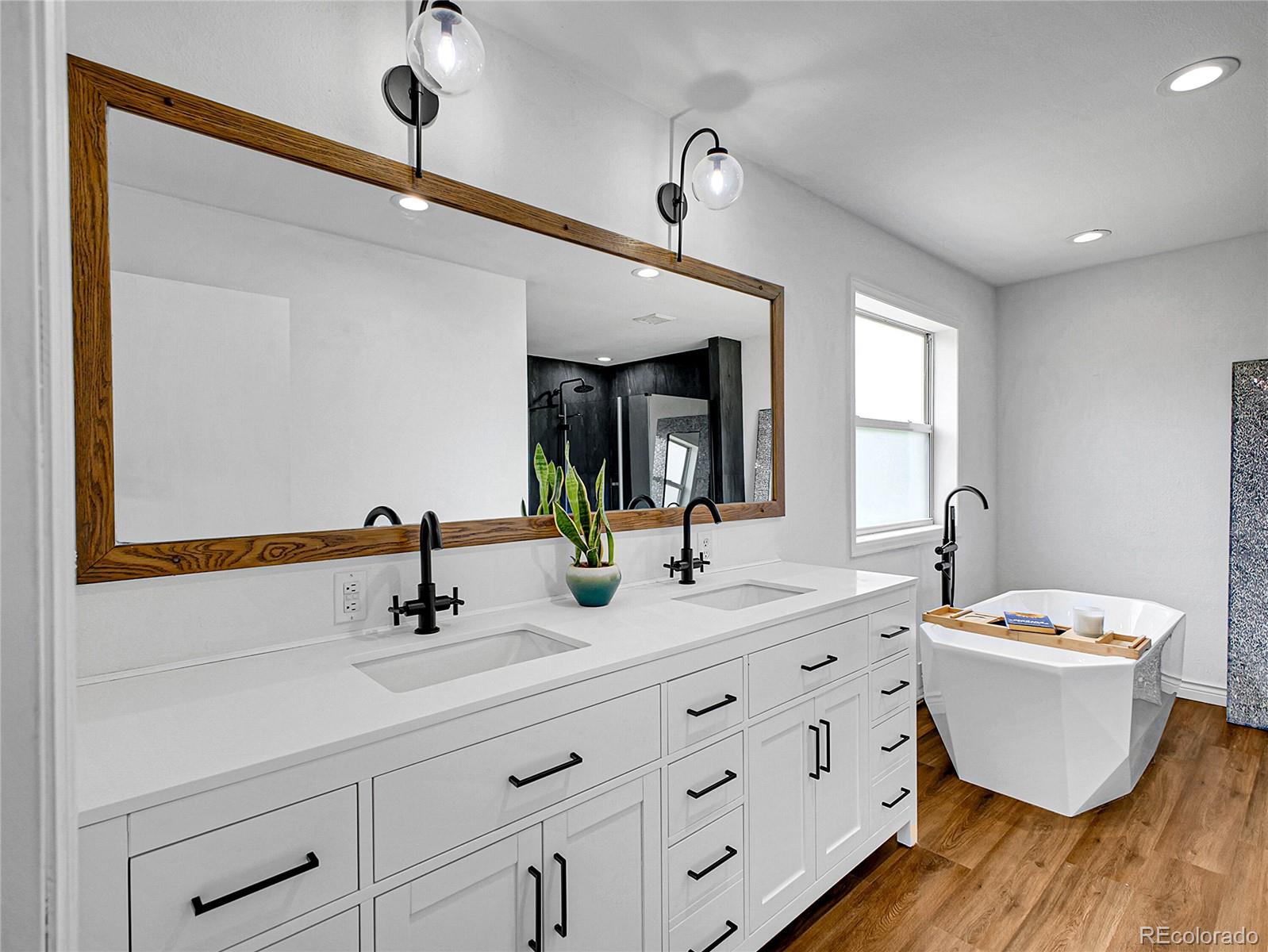 2635 Nova Road Pine, CO 80470 - Photo 29 of 45 a bathroom with a double vanity sink and a mirror