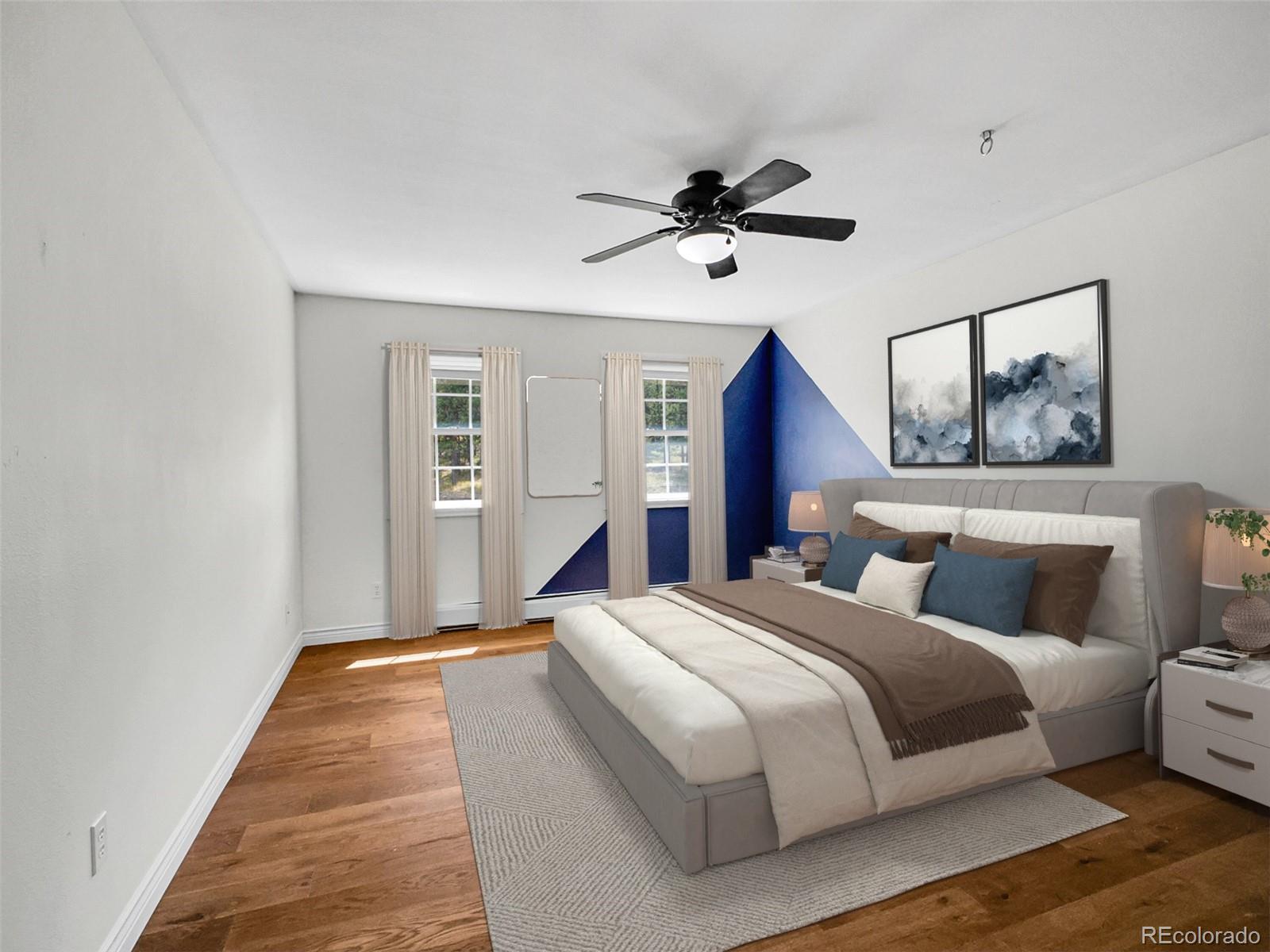 2635 Nova Road Pine, CO 80470 - Photo 33 of 45 a bedroom with bed and wooden floor