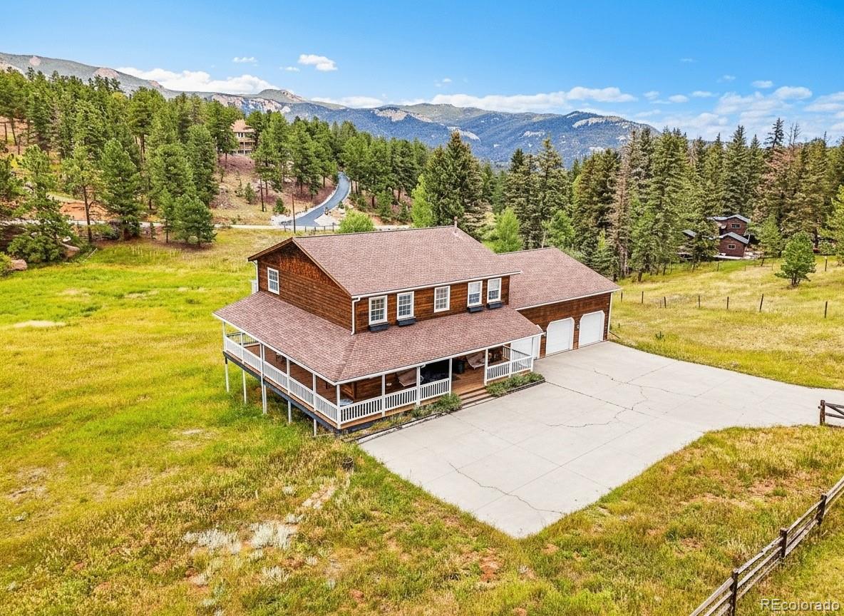 2635 Nova Road Pine, CO 80470 - Photo 43 of 45 a view of a house with a ocean view