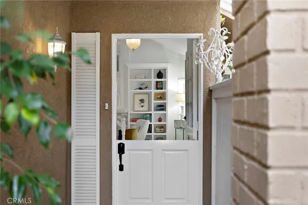 a view of front door and bedroom