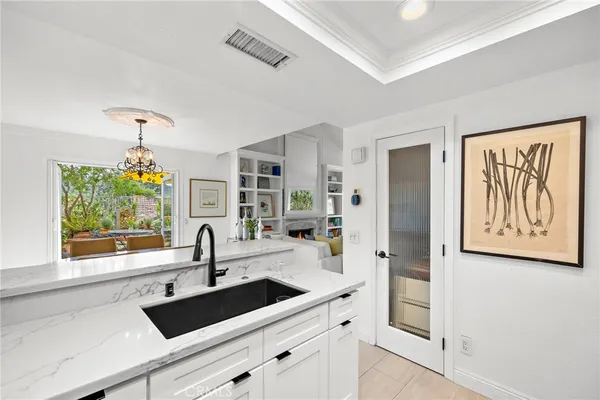 a kitchen with a sink and a refrigerator