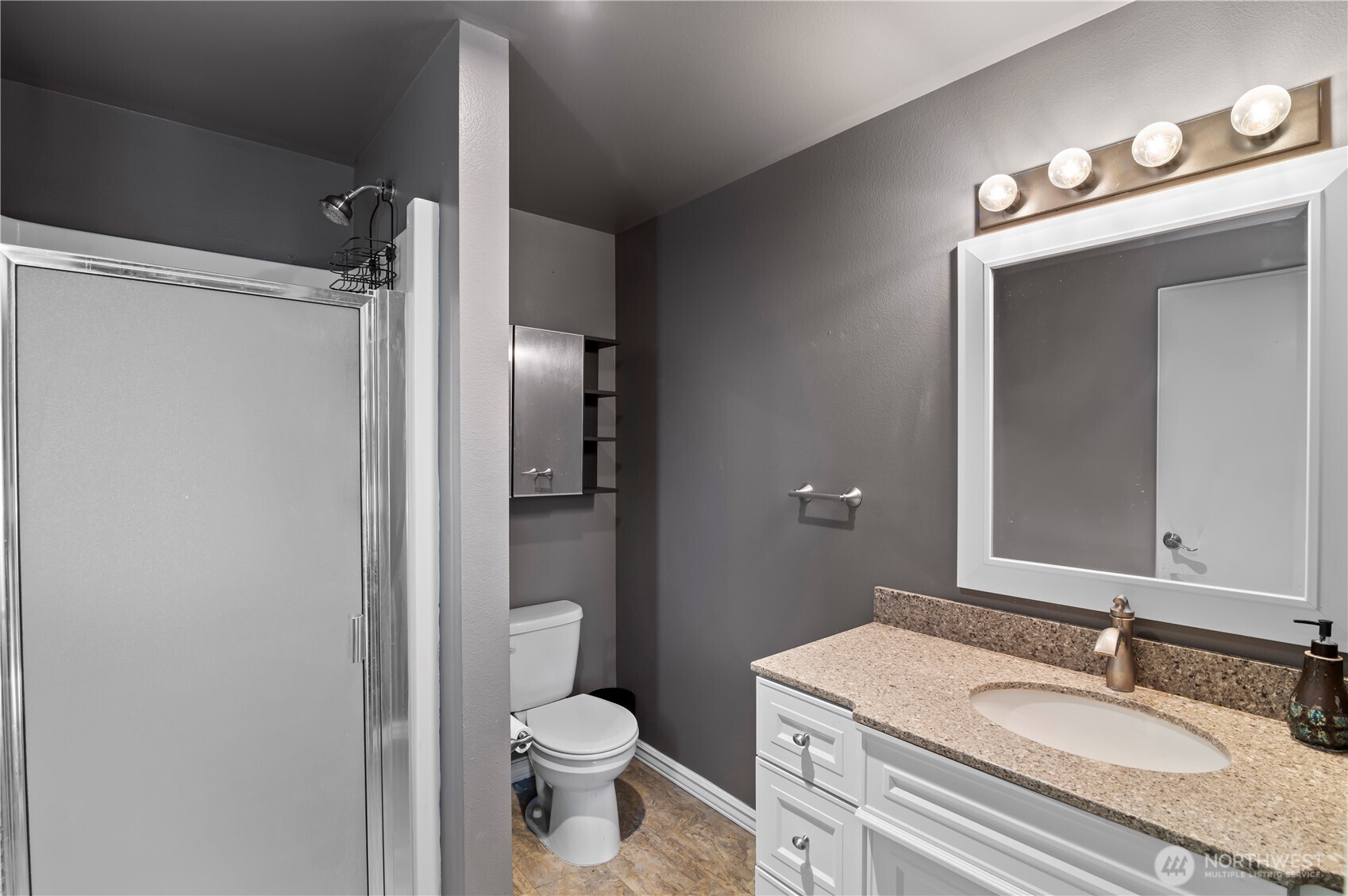 7805 260th Street Northwest Stanwood, WA 98292 - Photo 16 of 25 a bathroom with a sink toilet and shower