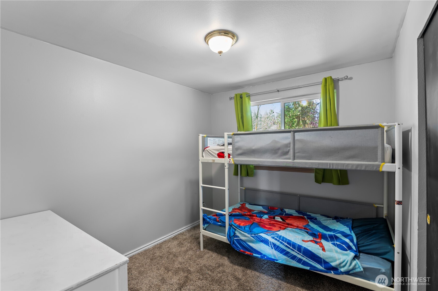 7805 260th Street Northwest Stanwood, WA 98292 - Photo 17 of 25 a bedroom with bed and window