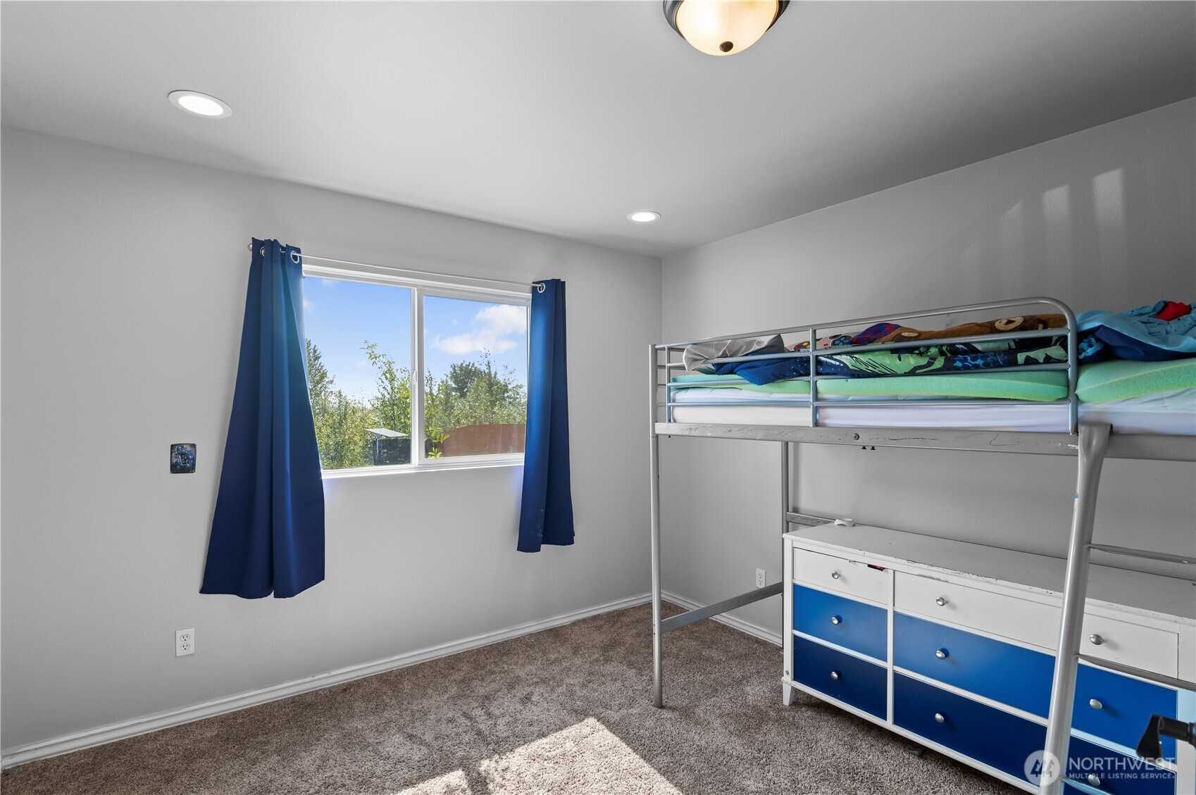 7805 260th Street Northwest Stanwood, WA 98292 - Photo 19 of 25 a room with a bed and a window