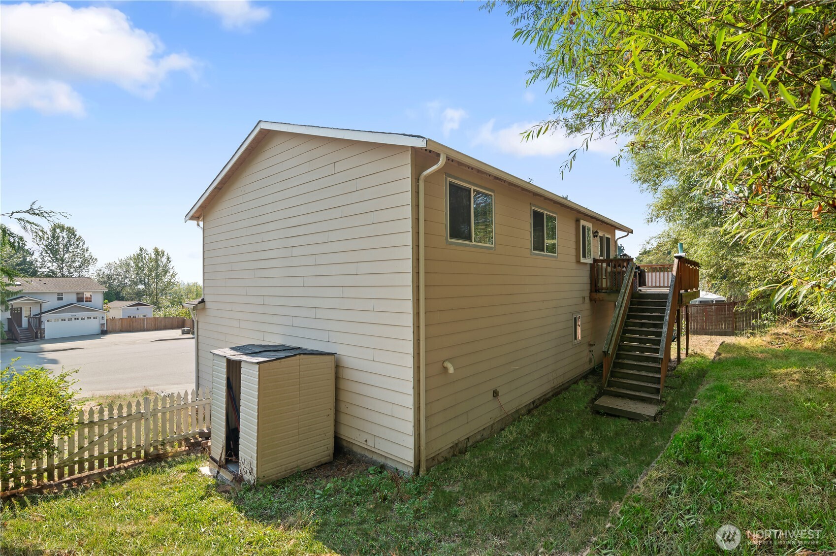 7805 260th Street Northwest Stanwood, WA 98292 - Photo 2 of 25 a view of a backyard with pathway