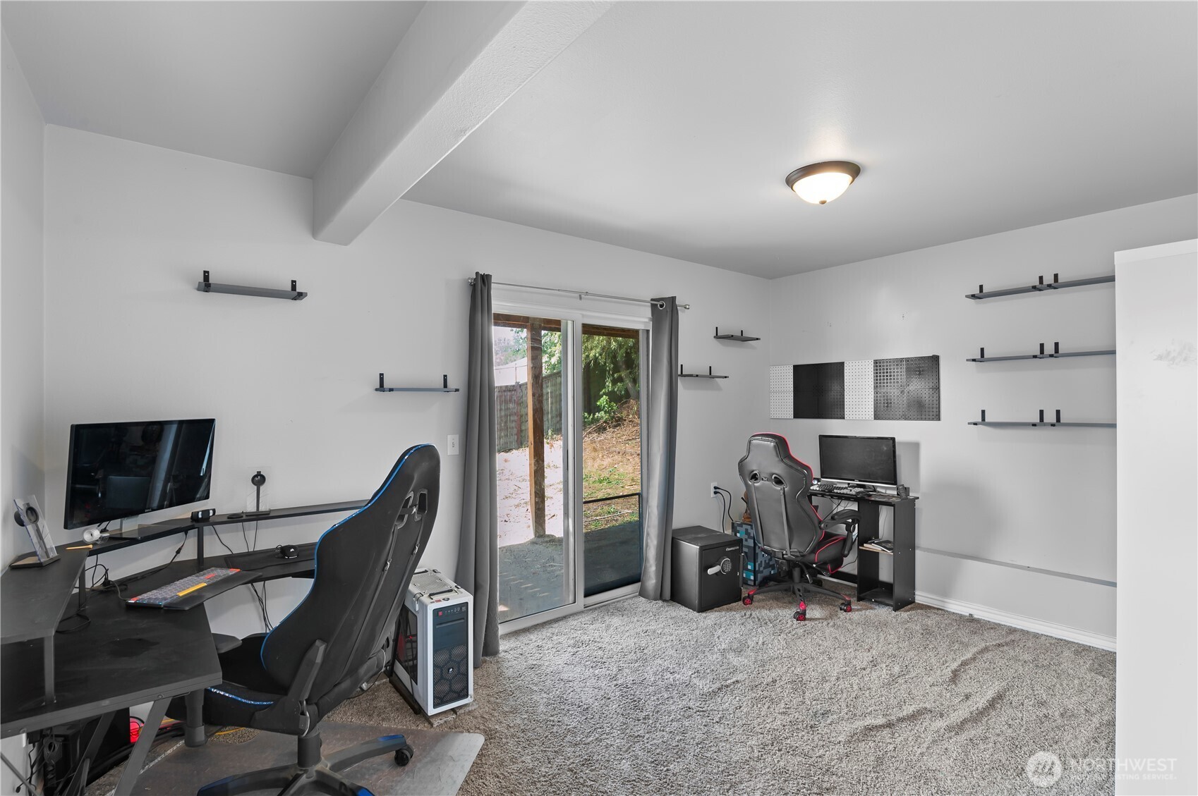 7805 260th Street Northwest Stanwood, WA 98292 - Photo 21 of 25 a view of a workspace with furniture and a window