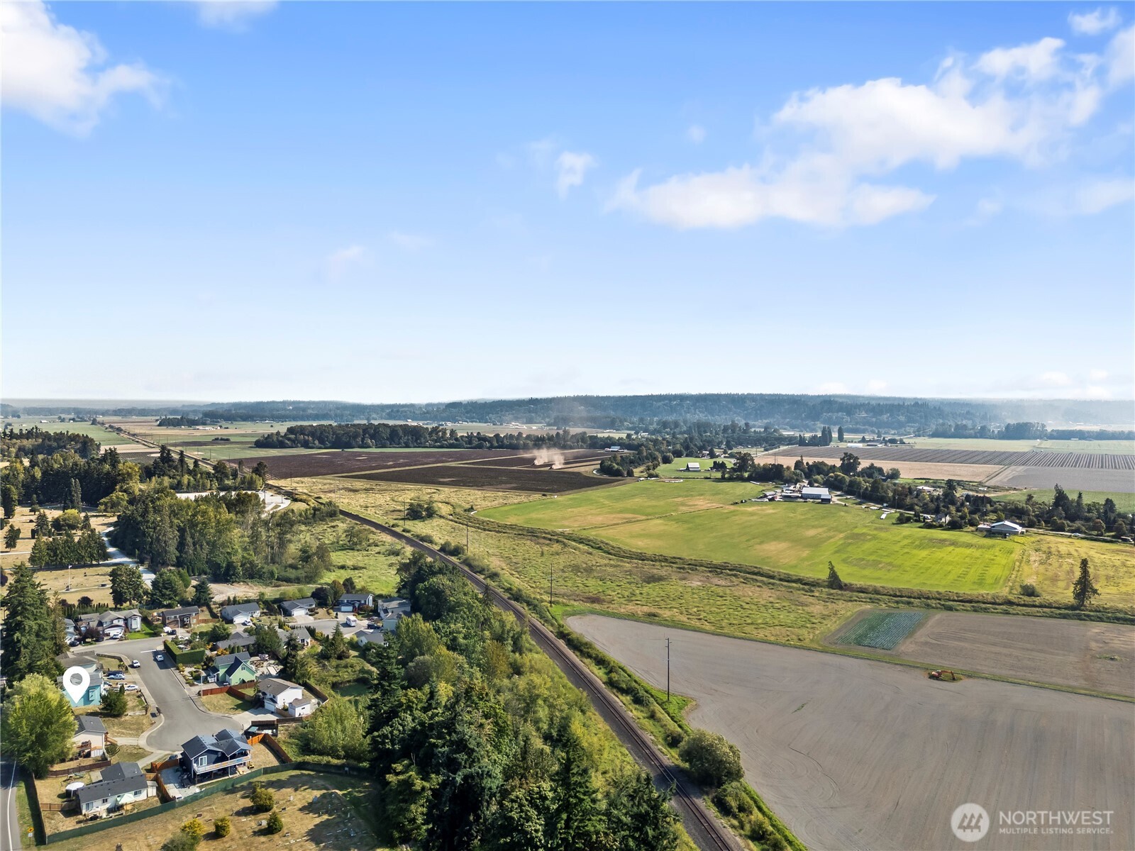 7805 260th Street Northwest Stanwood, WA 98292 - Photo 25 of 25 an aerial view of ocean and residential houses with outdoor space