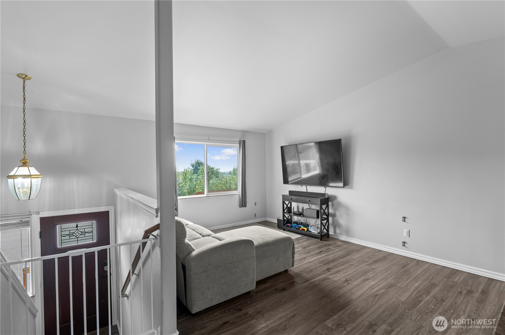 7805 260th Street Northwest Stanwood, WA 98292 - Photo 5 of 25 a living room with furniture and a flat screen tv