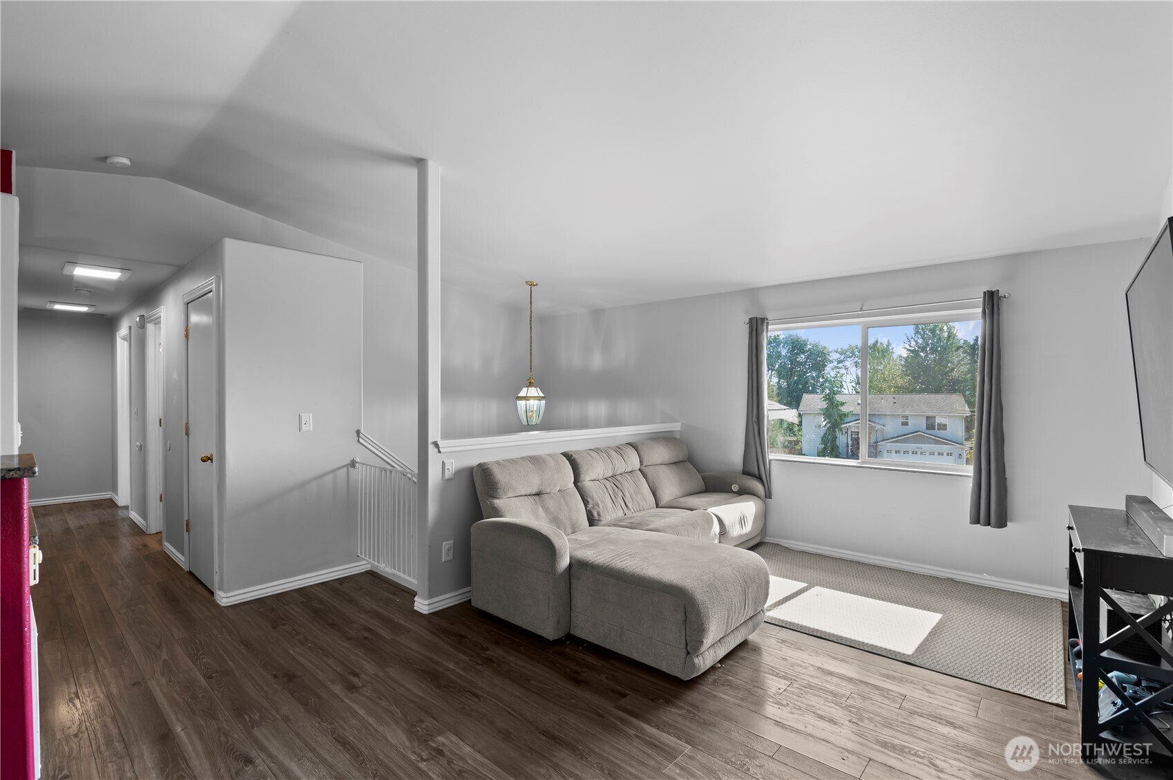 7805 260th Street Northwest Stanwood, WA 98292 - Photo 7 of 25 a bedroom with a bed and a large window