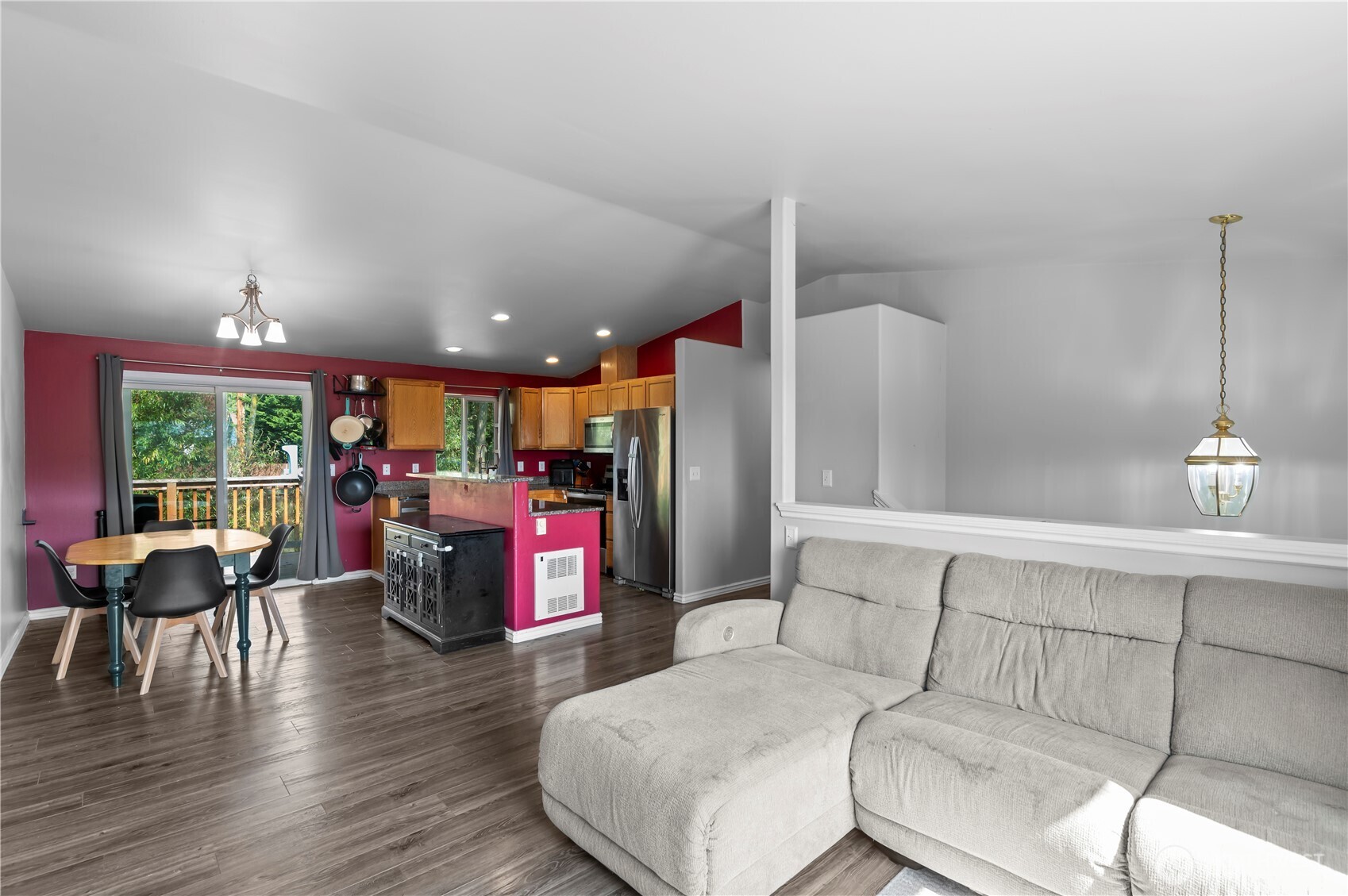 7805 260th Street Northwest Stanwood, WA 98292 - Photo 8 of 25 a living room with furniture and a wooden floor