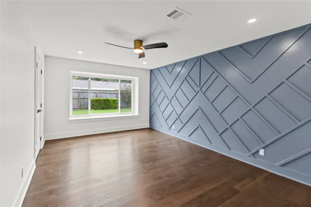 a room with furniture and a large window