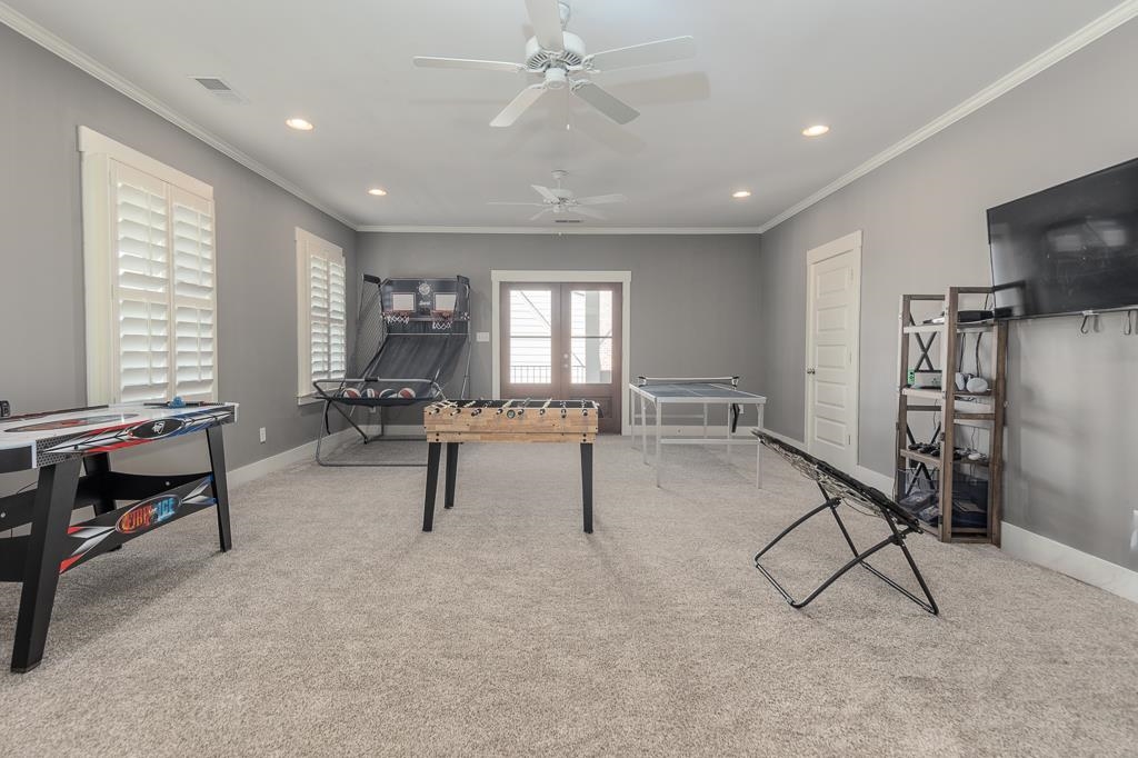 328 Washington Street Collierville, TN 38017 - Photo 25 of 33 Spacious room featuring light gray wall tones, crown molding, and plush carpeting