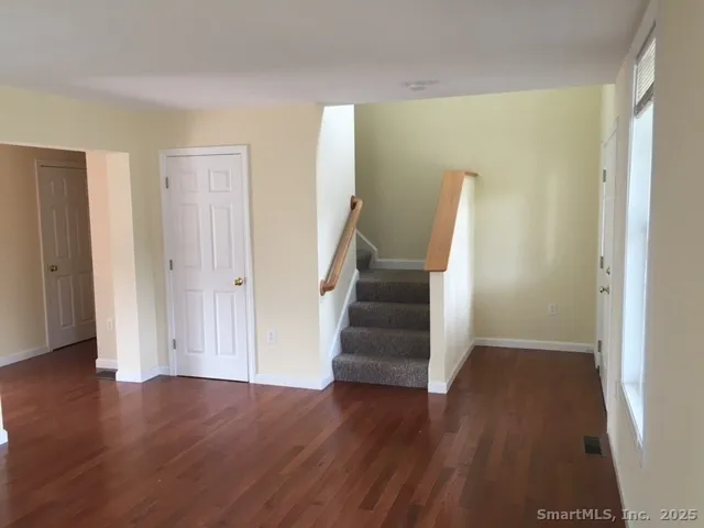 a view of entryway with wooden floor