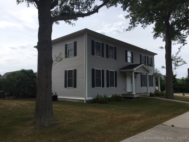 38 B Prospect Street Stonington, CT 06379 - Photo 10 of 13 a front view of a house with a yard