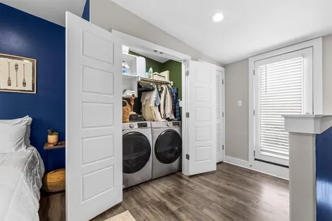 a bedroom with a bed and flat screen tv