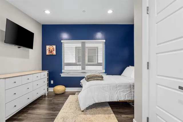 a view of a porch with a potted plant and a floor to ceiling window