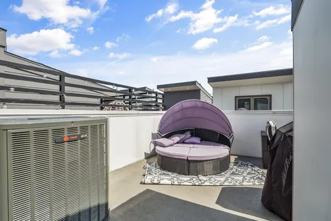 a view of a two chairs in the roof deck