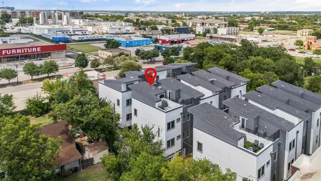 an aerial view of residential houses with outdoor space