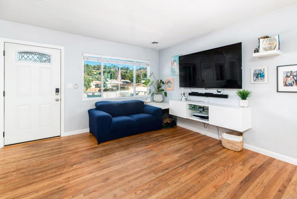 2914 Rosedale Court Spring Valley, CA 91977 - Photo 12 of 30 a living room with furniture and a flat screen tv