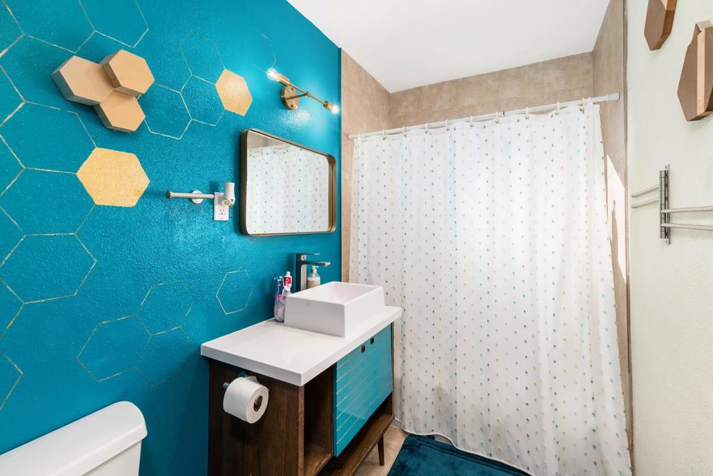 2914 Rosedale Court Spring Valley, CA 91977 - Photo 18 of 30 a bathroom with a sink vanity mirror and toilet