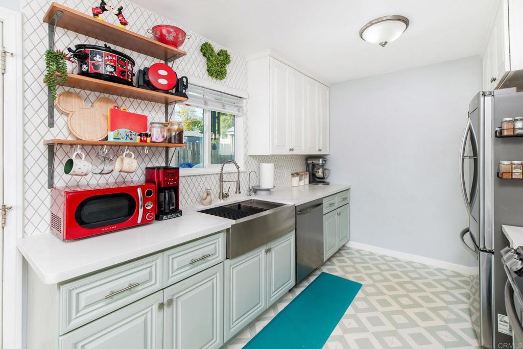 2914 Rosedale Court Spring Valley, CA 91977 - Photo 5 of 30 a kitchen with a stove a sink and a refrigerator