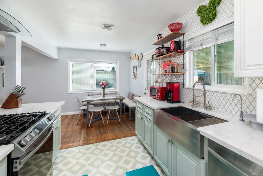 2914 Rosedale Court Spring Valley, CA 91977 - Photo 6 of 30 a kitchen with a wooden cabinets and stove