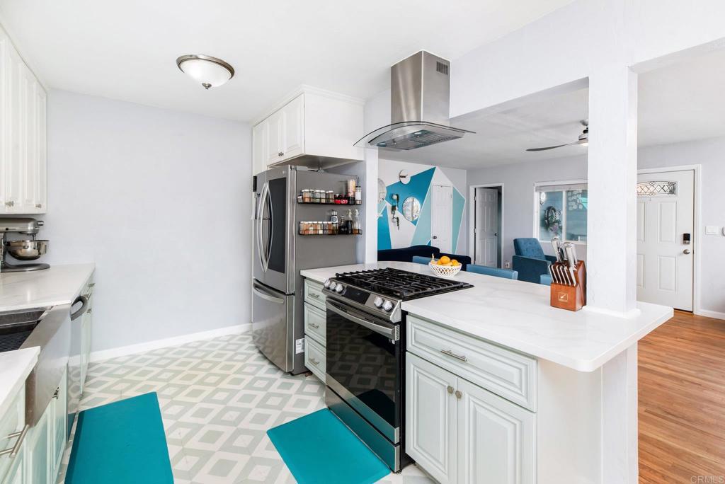 2914 Rosedale Court Spring Valley, CA 91977 - Photo 8 of 30 a kitchen with a stove and a refrigerator