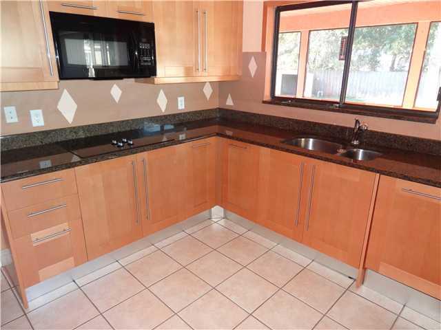 1601 Southwest Fortune Road Port St. Lucie, FL 34953 - Photo 11 of 23 a utility room with granite countertop cabinets and a sink