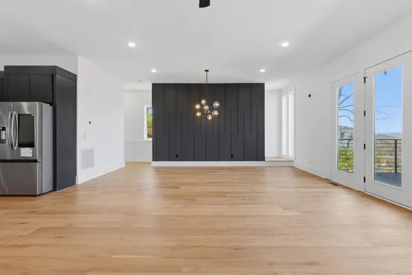 a kitchen with a stove sink and cabinets