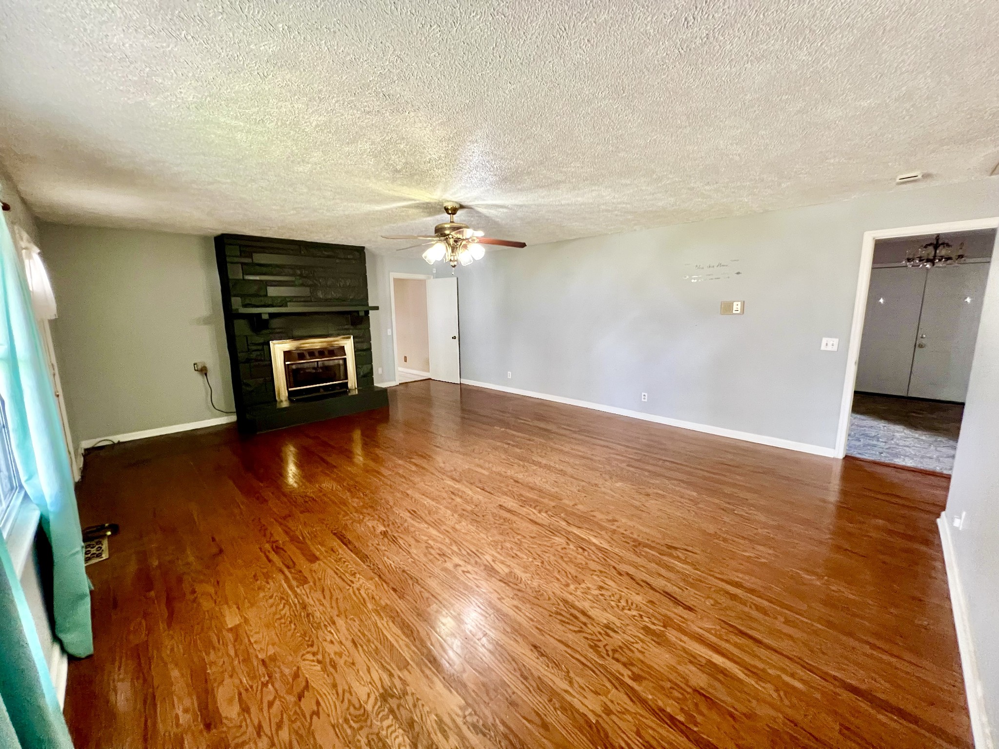 1100 Buffalo Road Lawrenceburg, TN 38464 - Photo 11 of 56 wooden floor in an empty room with a window