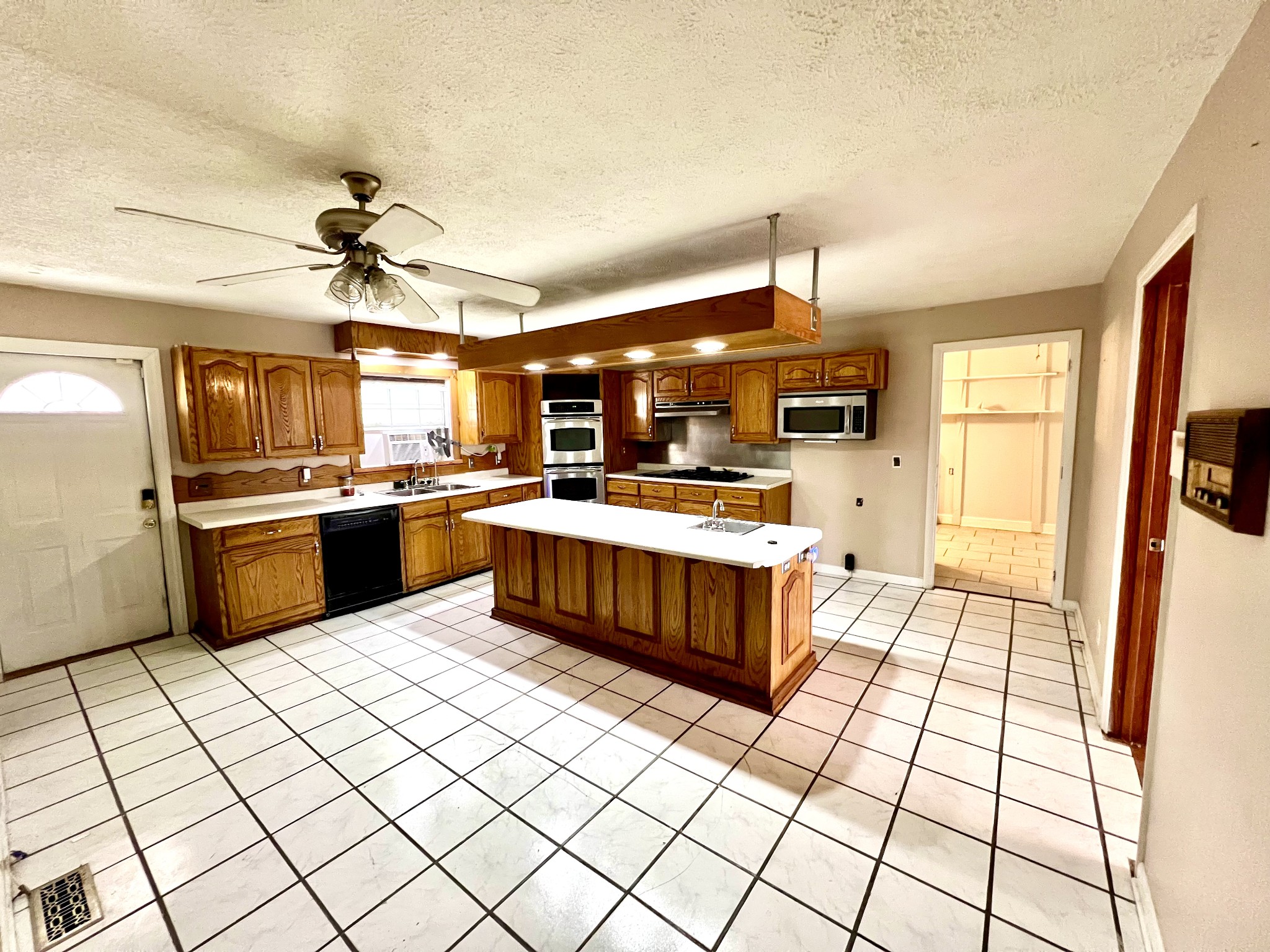 1100 Buffalo Road Lawrenceburg, TN 38464 - Photo 19 of 56 a kitchen with stainless steel appliances a sink and a counter top space
