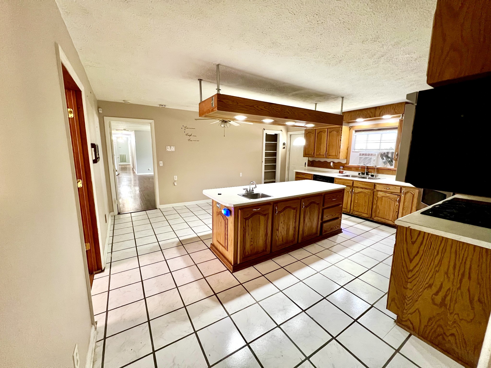 1100 Buffalo Road Lawrenceburg, TN 38464 - Photo 22 of 56 a large bedroom with a bed and wooden floor